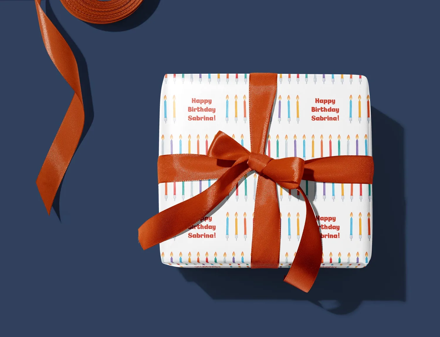 A birthday present wrapped in personalised paper